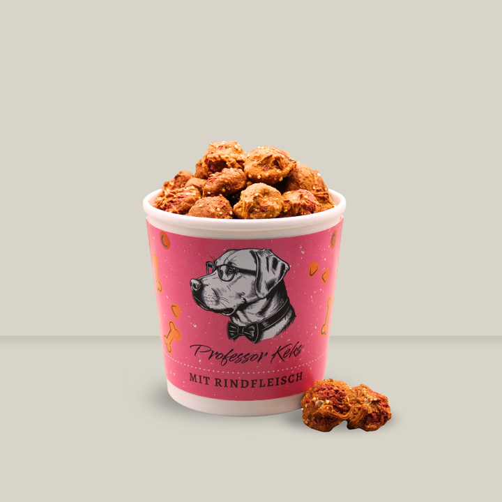 pinker Pappbecher von Professor Keks gefüllt mit kleinen Pasteten für Hunde