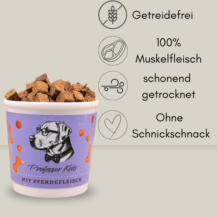 lila Pappbecher gefüllt mit Hundekeksen aus Pferdefleisch mit den Hinweisen Getreidefrei, 100% Muskelfleisch, schonend getrocknet und ohne schnickschnack